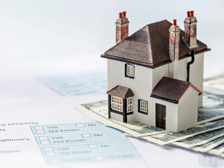 Small house figure on legal papers. Image complements the blog addressing asset protection and estate planning in North Carolina.