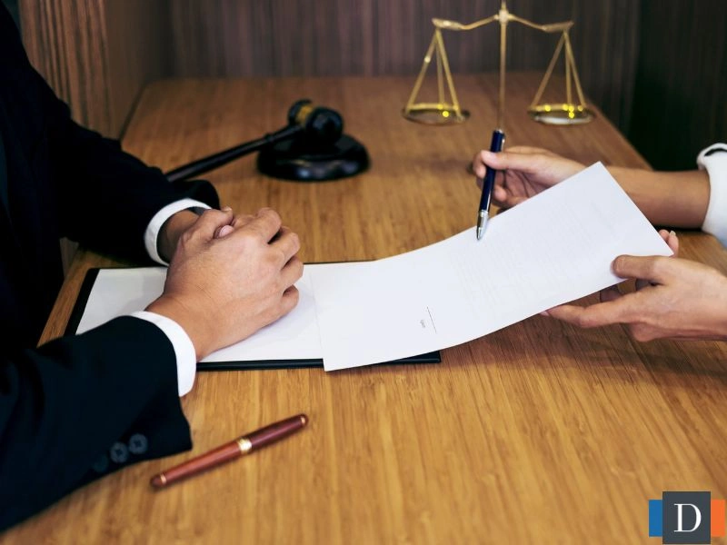 A lawyer explains a legal document to a client. This image is meant to accompany the page titled Inheritance Dispute Attorney in Cary, NC.