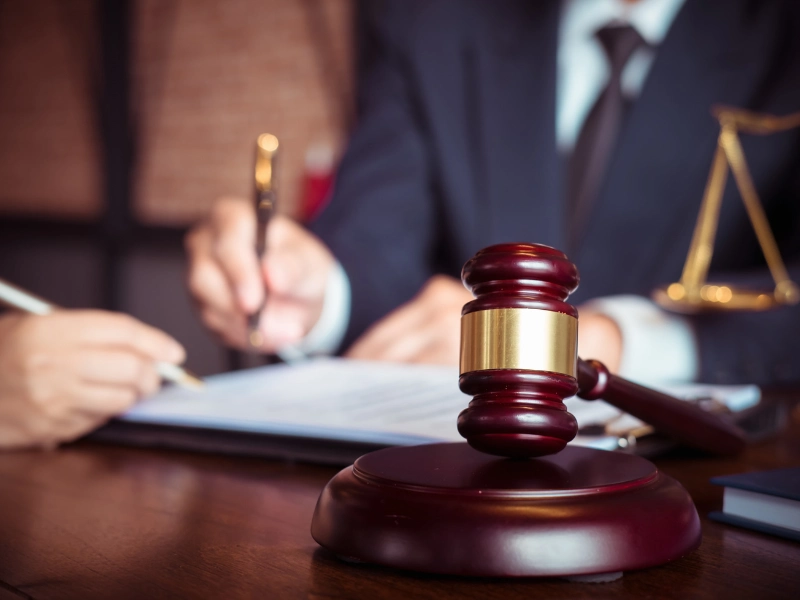 An estate planning attorney in Cary reviews a will and estate document with a client.