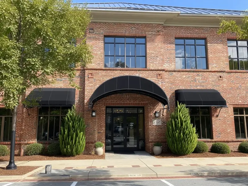 Brick office building in daylight. Wake Forest Law firm