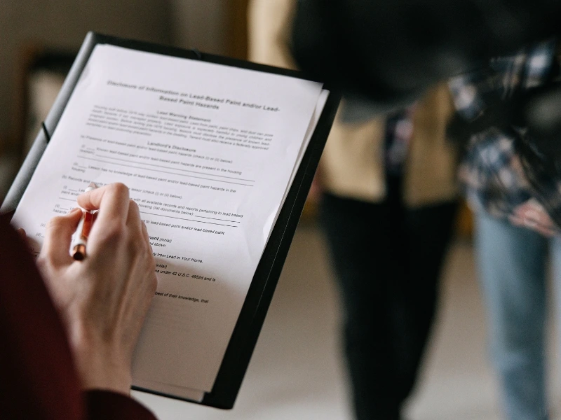 A Cary trusts lawyer signs a document.