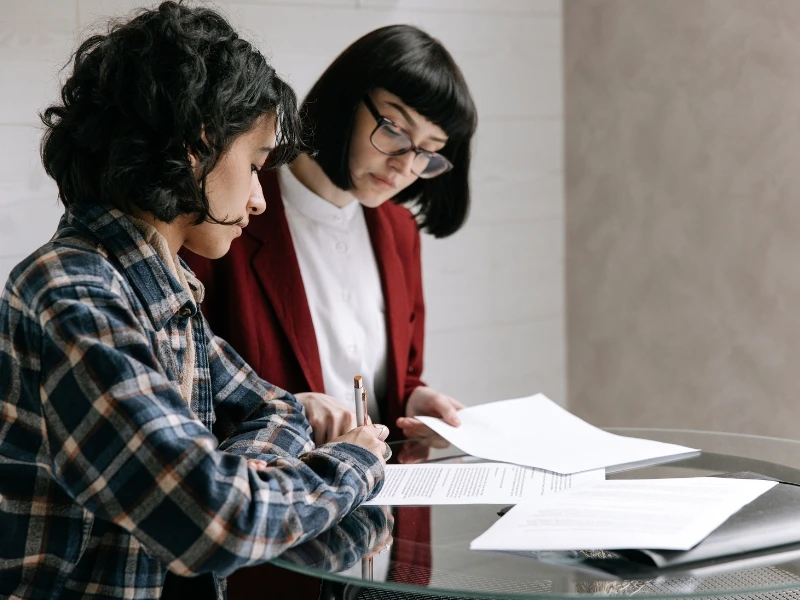 A Cary estate administration attorney reviews a document with a client.