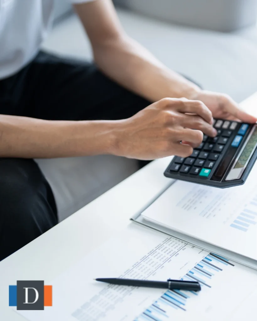 Person calculating estate finances to understand intestacy laws affecting property distribution after death.