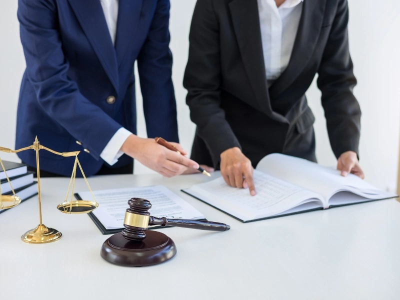 trusts lawyers review documents on a desk with a gavel