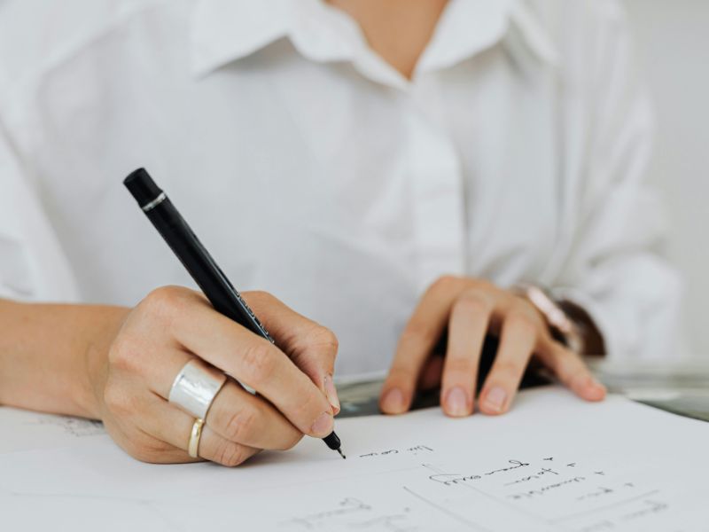 A woman writing a will.