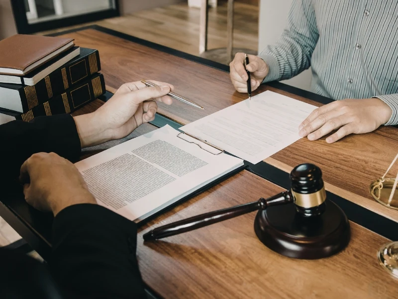 A Wake Forest lawyer working with a client to secure a will, trust, or estate plan.