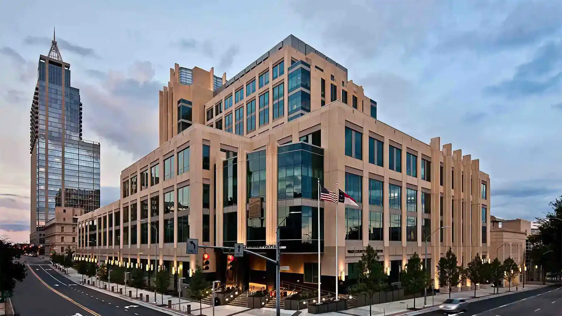 Exterior of a modern, government building. A Cary or Wake Forest wills and estates attorney will represent you here. wills lawyer, wills and estates attorney, estate planning attorney, trust lawyer, probate attorney, probate lawyer in Cary and Wake Forest, NC.