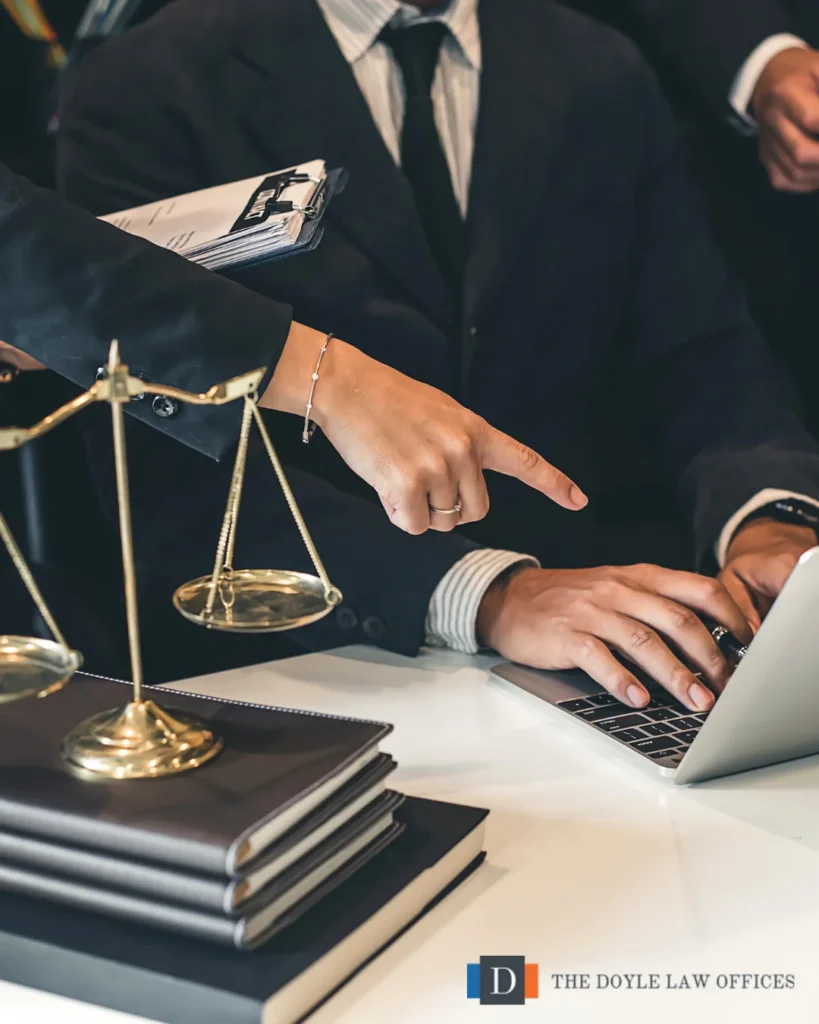 Corporate legal counsel reviewing documents and providing legal advice during a business meeting