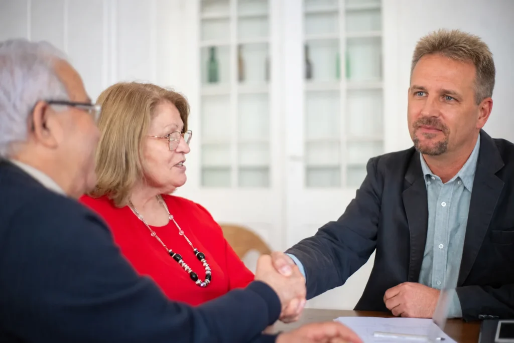 a Cary attorney shakes hands with a client. image complements the blog, What is a Power of Attorney?